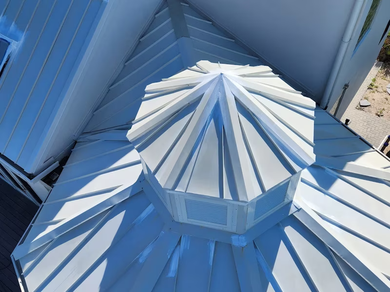 Aerial view of white painted commercial roof with cupola by RPB Painting Florida