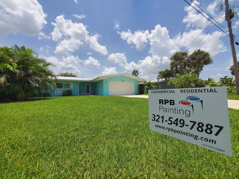 Ranch home exterior painting in teal by RPB Painting Florida