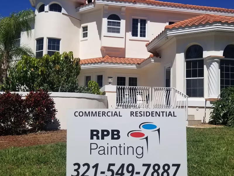 Two-story stucco home exterior painting by RPB Painting Florida