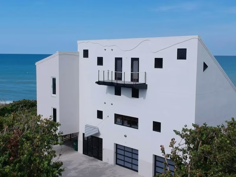 White modern beachfront home exterior painting by RPB Painting Florida